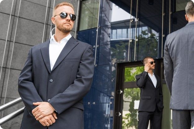 Trained security personal stands outside a cannabis facility secured by Silver Star Protection Group